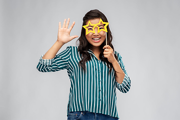 Image showing happy asian woman with star-shaped party glasses