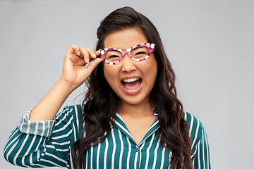 Image showing happy asian woman with party glasses