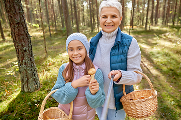 Image showing grandma with granddaughter taking selfie in forest