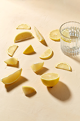 Image showing glass of water and lemon slices on table