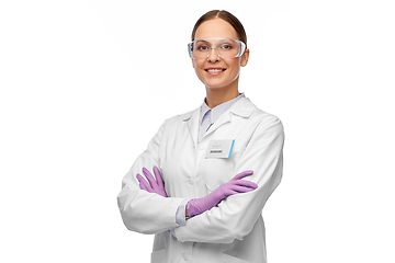 Image showing smiling female scientist in goggles and gloves