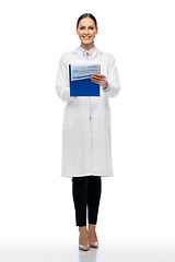 Image showing happy smiling female doctor with clipboard