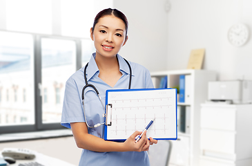 Image showing asian female doctor with cardiogram at hospital