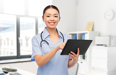 Image showing asian female nurse with tablet pc at hospital