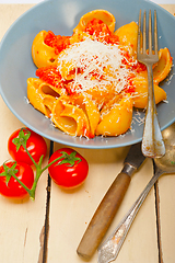 Image showing Italian snail lumaconi pasta with tomatoes