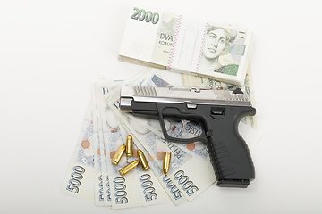 Image showing gun and czech banknotes, crime concept