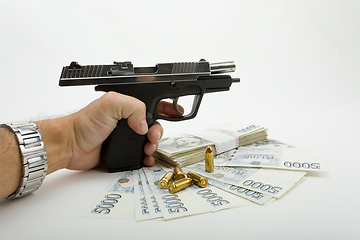 Image showing gun and czech banknotes, crime concept
