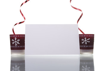 Image showing christmas candles holding a blank card 