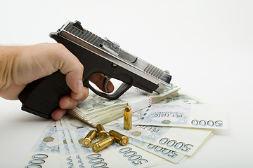 Image showing gun and czech banknotes, crime concept