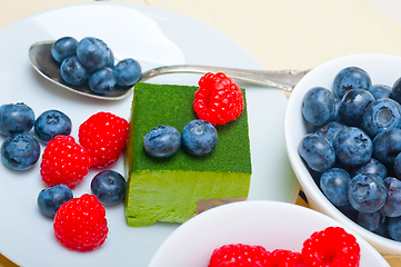 Image showing green tea matcha mousse cake with berries