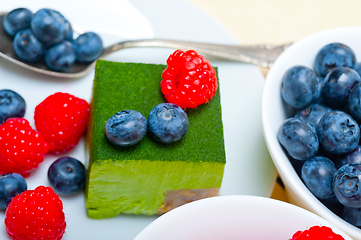 Image showing green tea matcha mousse cake with berries