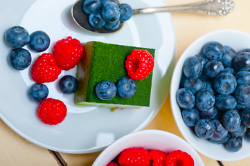 Image showing green tea matcha mousse cake with berries