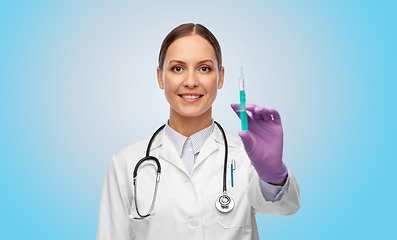 Image showing happy female doctor with medicine in syringe