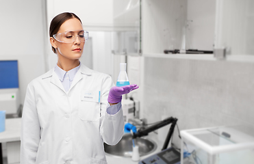 Image showing female scientist with chemical at laboratory