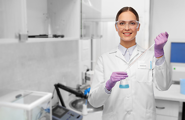 Image showing female scientist with chemical at laboratory