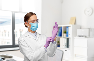 Image showing female doctor in gloves, mask and goggles