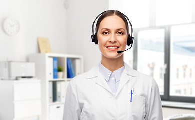 Image showing smiling female doctor with headset