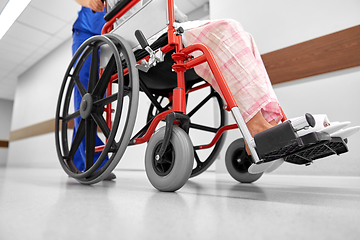 Image showing nurse with senior patient in wheelchair at clinic