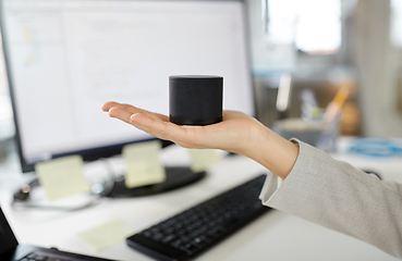 Image showing businesswoman using smart speaker at office