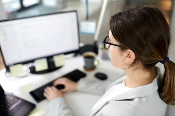 Image showing businesswoman with computer working at office