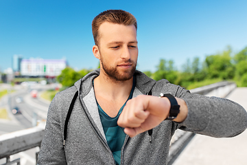 Image showing man with smart watch outdoors