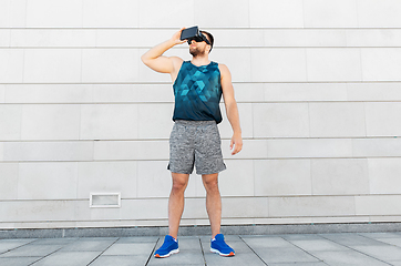 Image showing young man in sports clothes with vr glasses