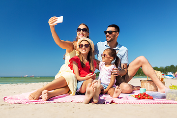 Image showing happy family taking selfie on summer beach