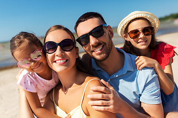 Image showing happy family in sunglasses on summer beach