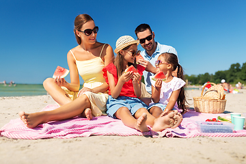 Image showing happy family having picnic on summer beach