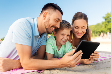 Image showing happy family with tablet computer on summer beach