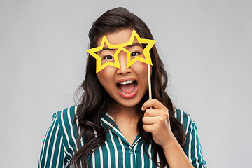 Image showing happy asian woman with star-shaped party glasses