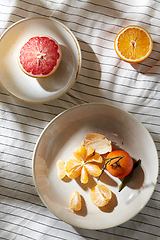 Image showing still life with mandarins and grapefruit on plate