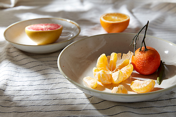 Image showing still life with mandarins and grapefruit on plate