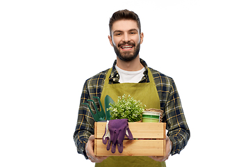 Image showing happy gardener or farmer with box of garden tools