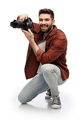 Image showing smiling man or photographer with digital camera