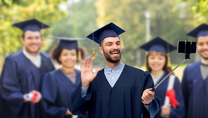 Image showing male graduate student with smartphone takes selfie