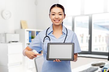 Image showing asian female nurse with tablet pc at hospital