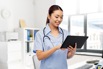 Image showing asian female nurse with tablet pc at hospital