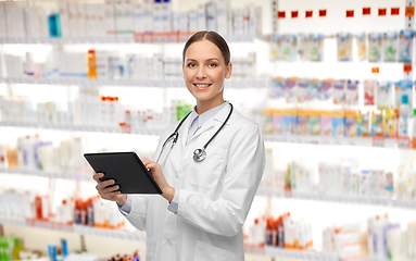 Image showing happy female doctor with tablet pc and stethoscope