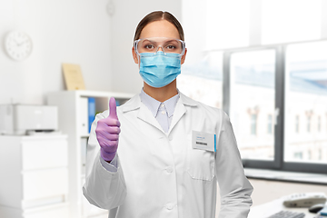 Image showing female scientist in medical mask and goggles