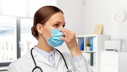 Image showing happy female doctor wearing medical mask