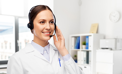 Image showing smiling female doctor with headset