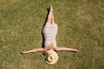 Image showing woman laying in the grass