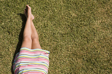 Image showing woman legs at the grass