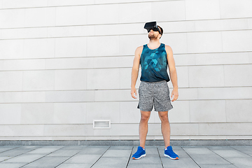 Image showing young man in sports clothes with vr glasses