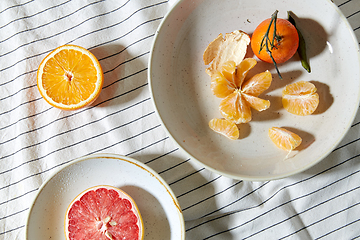 Image showing still life with mandarins and grapefruit on plate