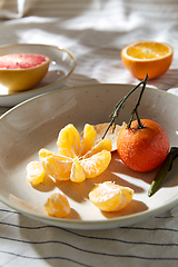 Image showing still life with mandarins and grapefruit on plate