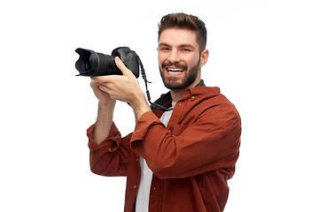 Image showing smiling man or photographer with digital camera