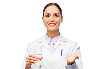 Image showing female doctor with medicine and glass of water