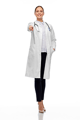 Image showing happy female doctor pointing to you